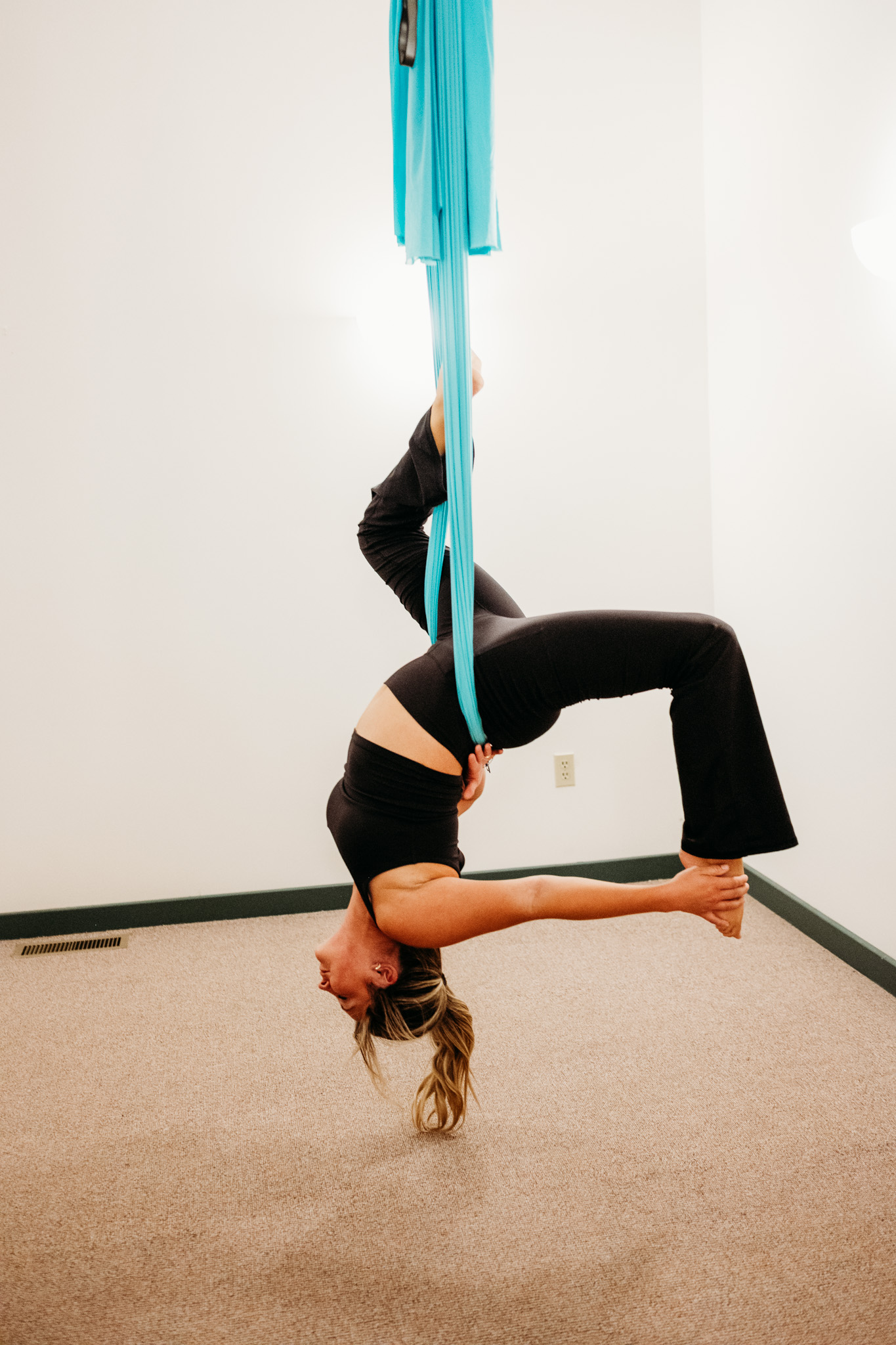 Brittany practising aerial yoga