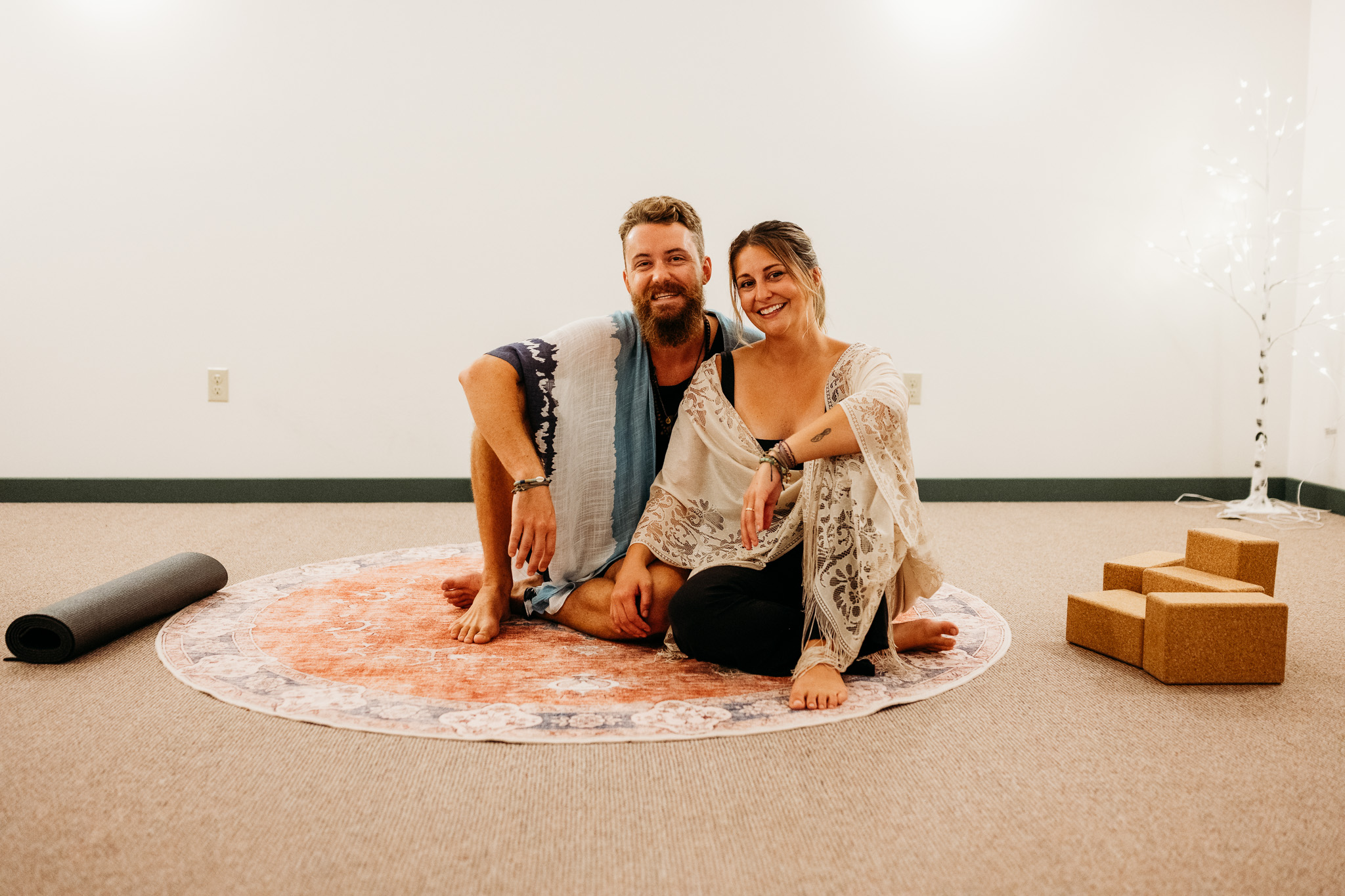 Brittany and James together at their yoga studio