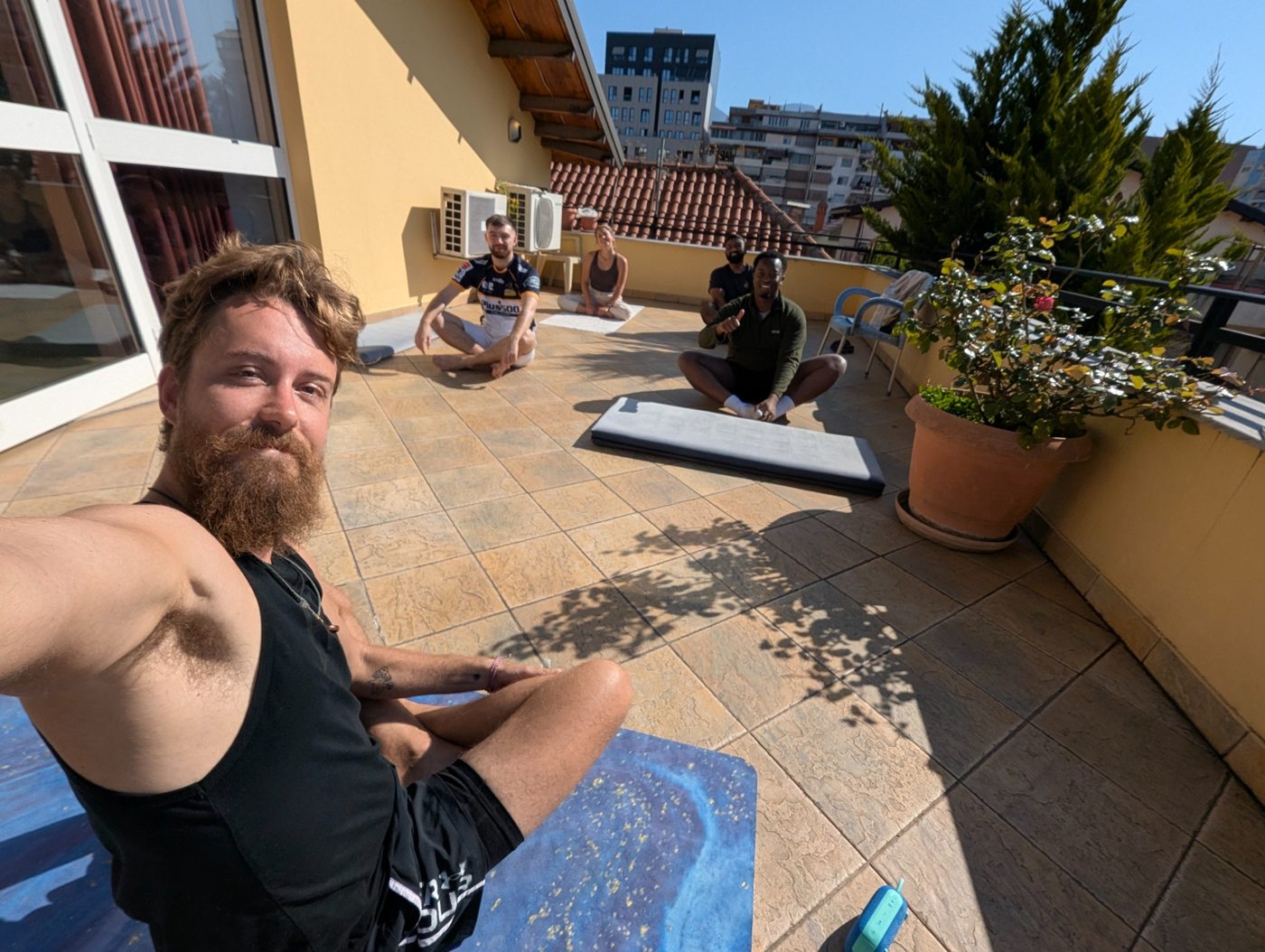 Yoga together on a sunny terrace